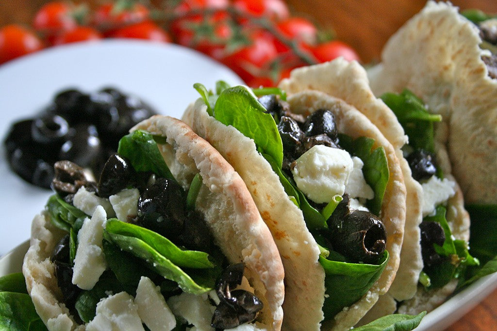 Warm Mrs Bell's Salad Cheese, Baby Spinach & Olive Pitta Breads